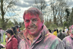 MP covered in coloured powder at Holi Festival